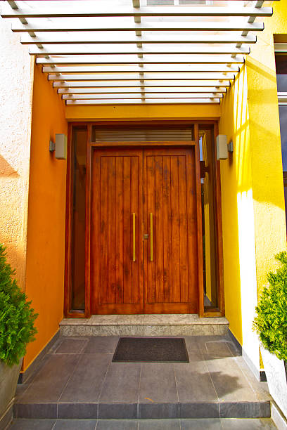 Wooden Front Door of a Modern House stock photo