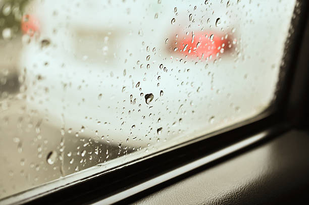 istock Close up of water drops on car window 185139962