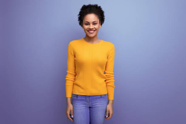 istock cheerful young 25 year old hispanic lady with afro tail in studio background with copy space 1851401484
