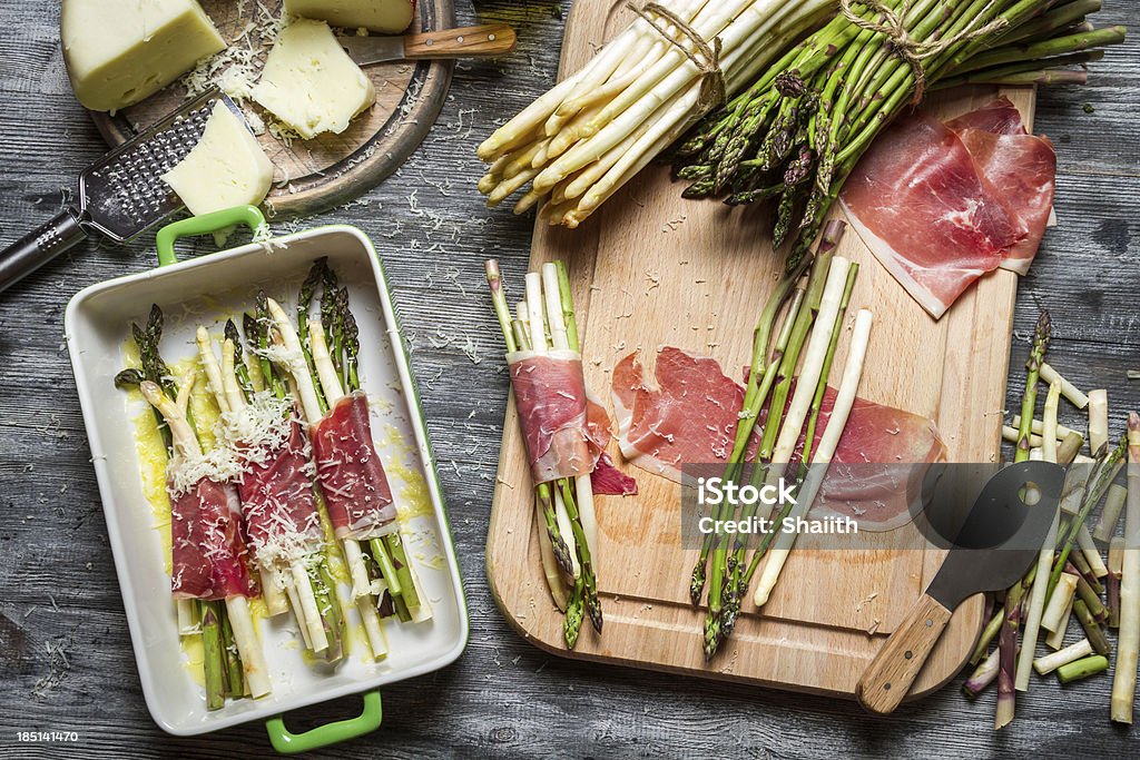 Asparagus wrapped in Parma ham casserole Asparagus wrapped in Parma ham casserole. Appetizer Stock Photo