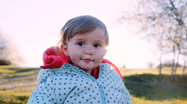 istock Gen Alpha baby girl becomes a nature lover. First steps. 1851417687