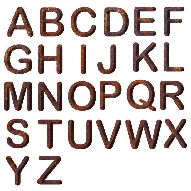 Close-up of three-dimensional rusty metal alphabet on white background.