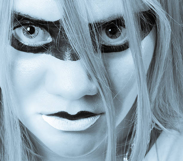 istock woman with intense eyes looking straight into the camera 185142319
