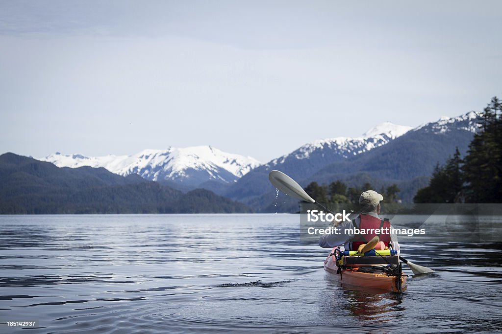 Adult Male Kayaking in Sitka Harbor Alaska Kayaking in Sitka Harbor, Alaska Alaska - US State Stock Photo