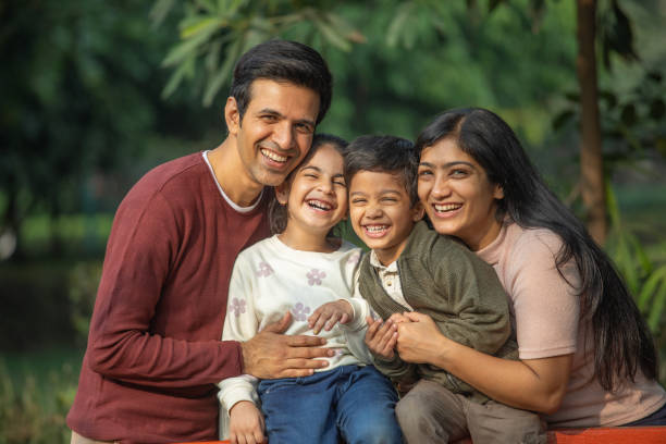 istock Happy family enjoying weekend in park 1851467060