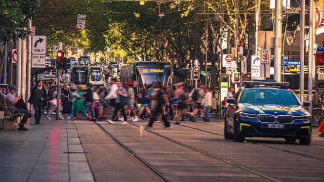 Footage Time lapse of Moving Tram with Crowded Commuter and Tourist waiting in rush hour, Swanston Street, down town, Southern Cross station in Melbourne, Victoria, Australia