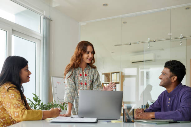 istock Businesswoman Explaining Idea to Colleagues 1851492388