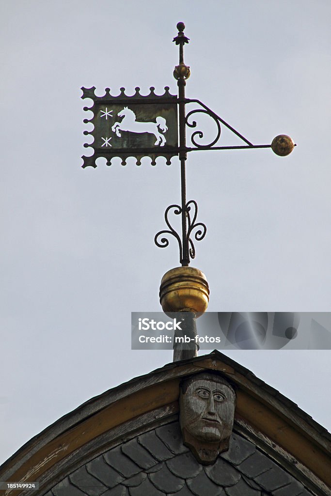 Weather vane on a roof in Bad Gandersheim Compass Rose Stock Photo