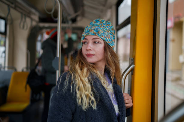 istock Young woman standing in tramway 1851500198
