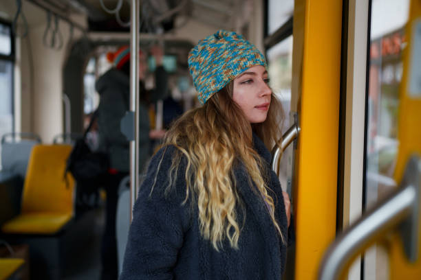 istock Young woman standing in tramway 1851500701
