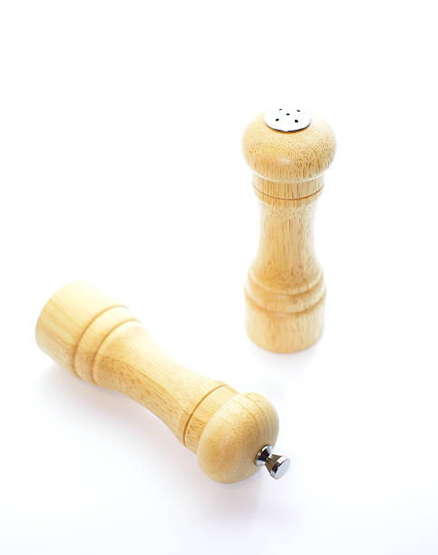 istock Wood pepper mill and salt shaker isolated on white 185150074