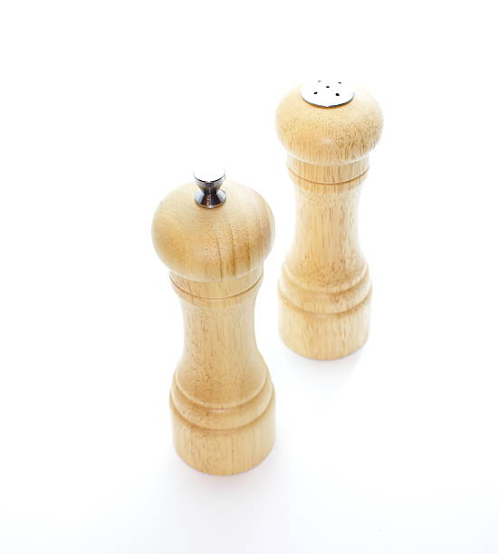 istock Wood pepper mill and salt shaker isolated on white 185150081