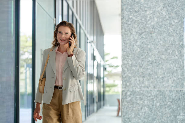istock Middle-aged Woman Talking on Phone with Friend 1851517214