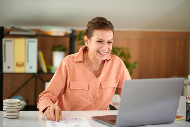 istock Woman Laughing at Memes at Workplace 1851519309