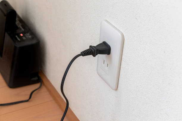 istock The power plug of the device inserted into the wall outlet 1851522463