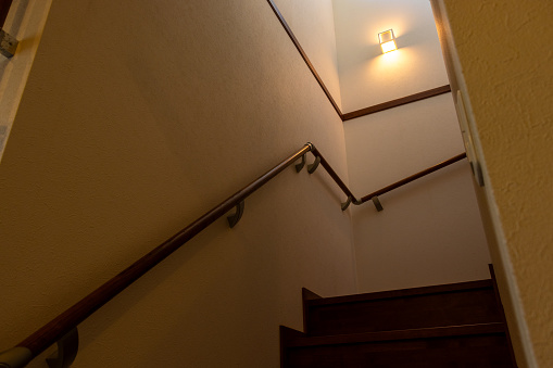 Dim staircase with a small light