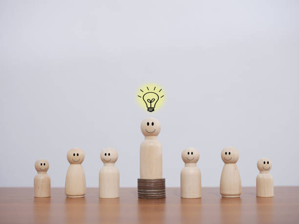 istock Wooden business figure with light bulb for leadership, creative, idea, innovation concept. 1851549598