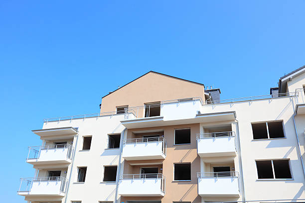 istock Construction site of local homes with rooftops 185155083