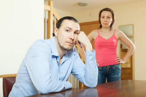 Family conflict. Middle-aged couple after quarrel at home