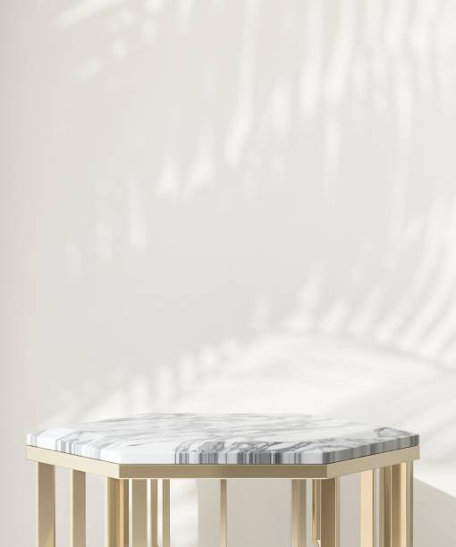 istock Marble, gold podium table in sunlight, palm tree leaf shadow on wall 1851568469