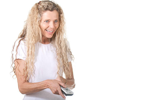 Woman with remote control stock photo