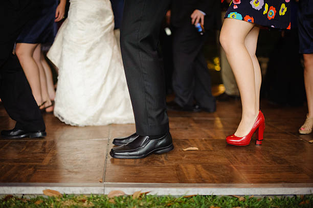 istock Legs down image of people dancing at wedding reception. 185157491