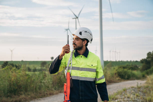 istock Service engineers checking system of windmill at wind farm. Wind turbines generate electricity. Clean and Renewable energy concept. 1851605814