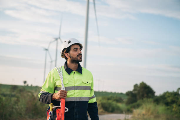 istock Service engineers checking system of windmill at wind farm. Wind turbines generate electricity. Clean and Renewable energy concept. 1851613649