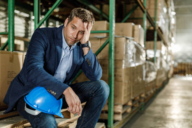 istock Displeased manager thinking of his problems in a warehouse. 1851619992