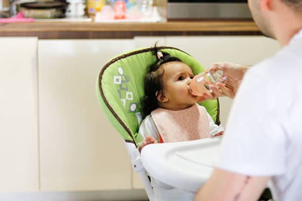 istock Father feeds his baby 1851621554