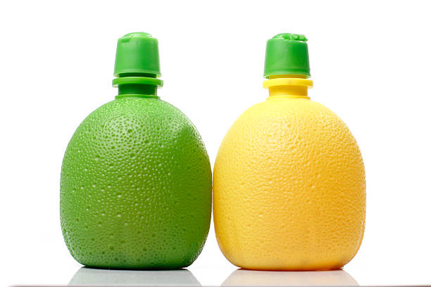 istock Orange and Lemon juice bottles on White background 185166564