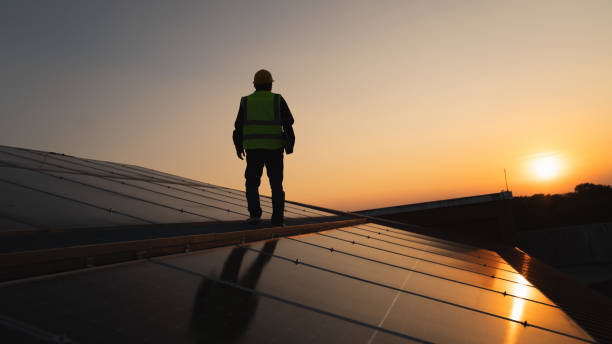 istock Service engineer checking solar cell on the roof for maintenance if there is a damaged part. Engineer worker install solar panel. Clean energy concept. 1851668371