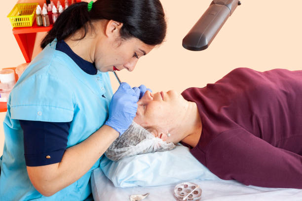istock Professional beauty - eyebrow shaping in a cosmetology studio 1851674949