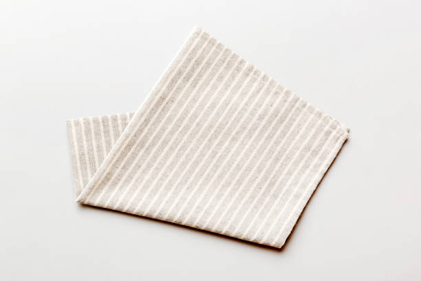 istock top view with gray kitchen napkin isolated on table background. Folded cloth for mockup with copy space, Flat lay. Minimal style 1851675802