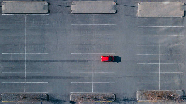 istock A red car is standing alone in the parking lot 1851675805