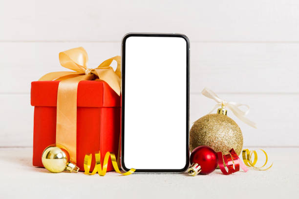 istock Digital phone mock up with rustic Christmas decorations for app presentation with empty space for you design. Christmas online shopping concept. Tablet with copy space on colored background 1851675807