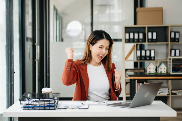 istock Young beautiful woman using laptop and tablet while sitting at her working place. Concentrated at work. 1851684773