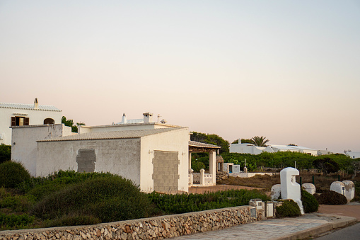 Abandoned Houses at Dusk: Capturing the Neglected State of Two White Mediterranean Houses