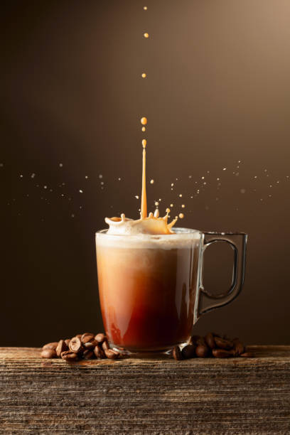 istock Coffee and chocolate drink with cream on a brown background. 1851693776
