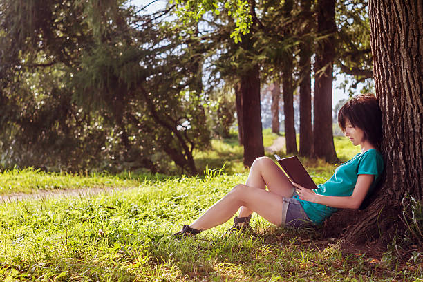 istock Girl reading in the nature 185170678