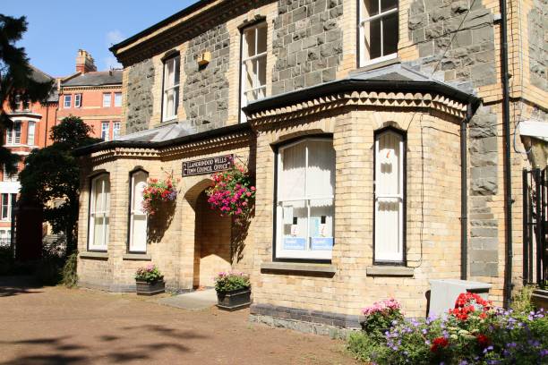 istock Beautiful old building situated on a street corner, featuring many windows in its exterior 1851723845