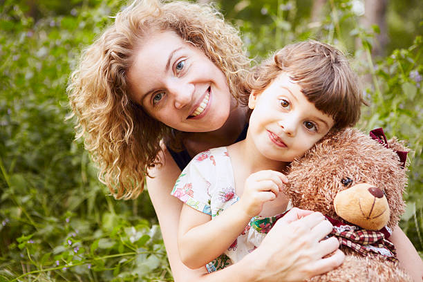 istock Mother and daughter portrait with a teddy bear 185172771