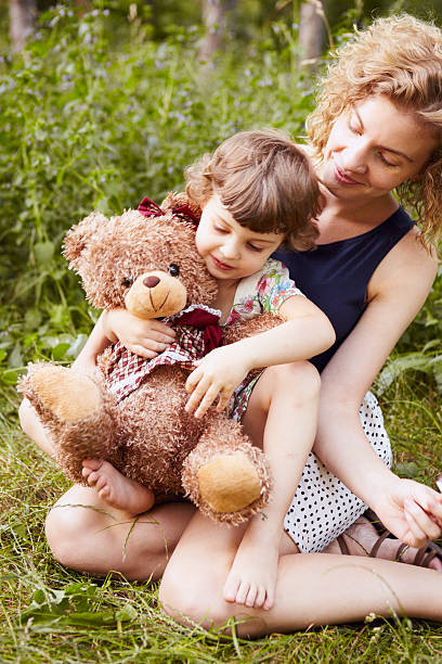istock Mother and daughter portrait with a teddy bear 185172815