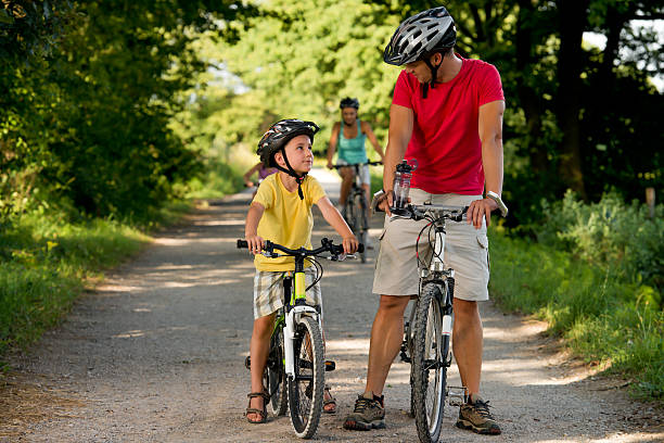 istock Family cycling in park. 185172909