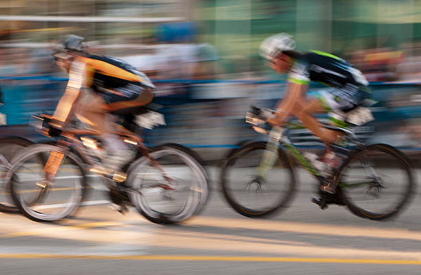 istock Two professional Cyclists and a blur of spectators 185173900