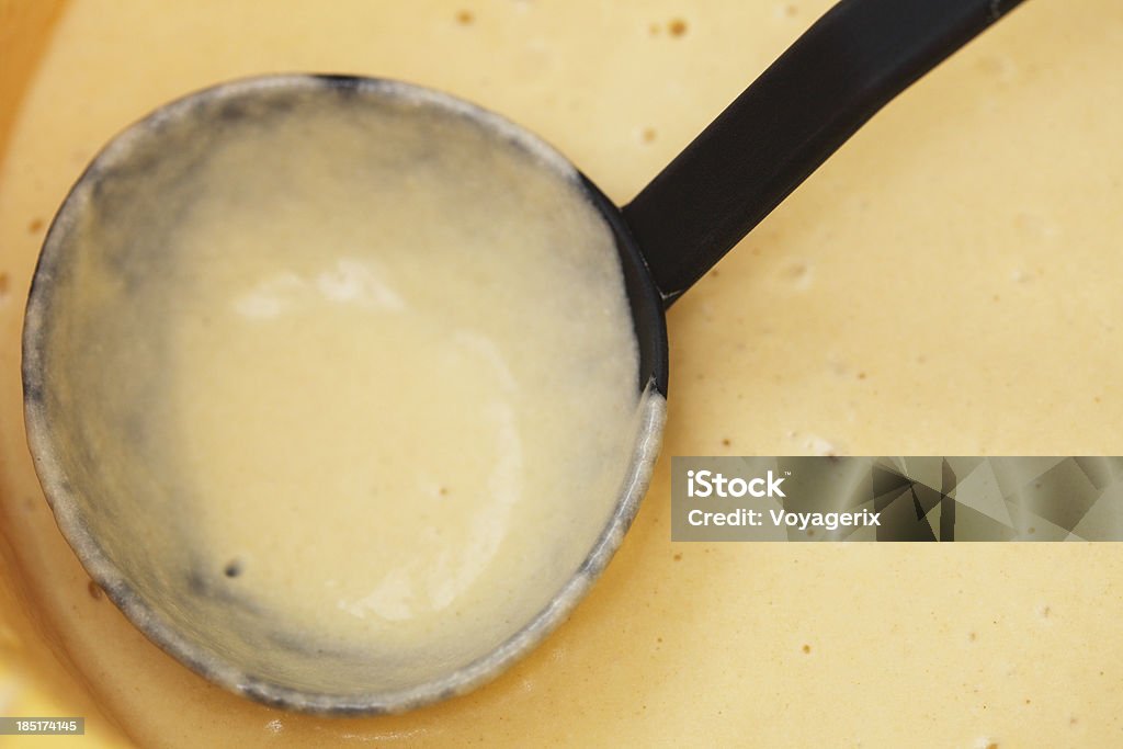 Bowl and ladle of pancake batter. Closeup bowl and ladle of pancake batter. Waffle preparing. Baked Pastry Item Stock Photo