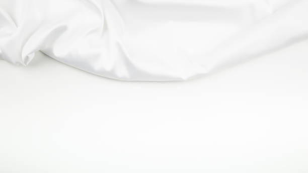 Abstract smooth elegant white silk or satin luxury cloth texture can use as wedding background.