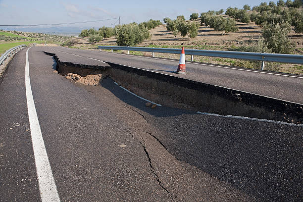 istock Asphalt road with a crack caused by landslides 185175695