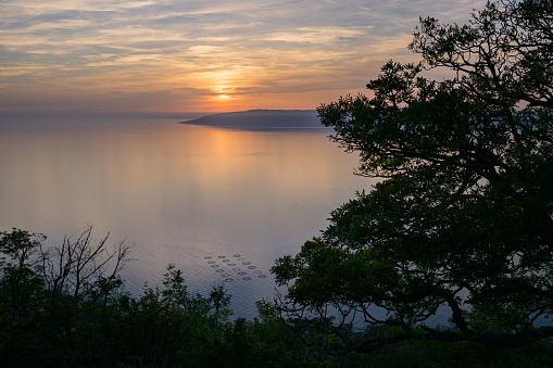Sunset over the sea in Croatia (island Cres), blue sky