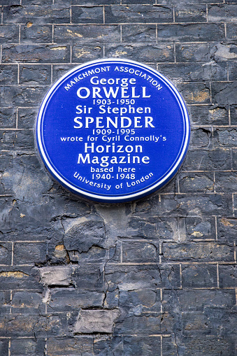 Lansdowne Terrace, London, England - October 28th 2023: Memorial plaque on a wall to mark the Horizon magazine and its writers: George Orwell and Sir Stephen Spender. This kind of plaques can be seen all over London
